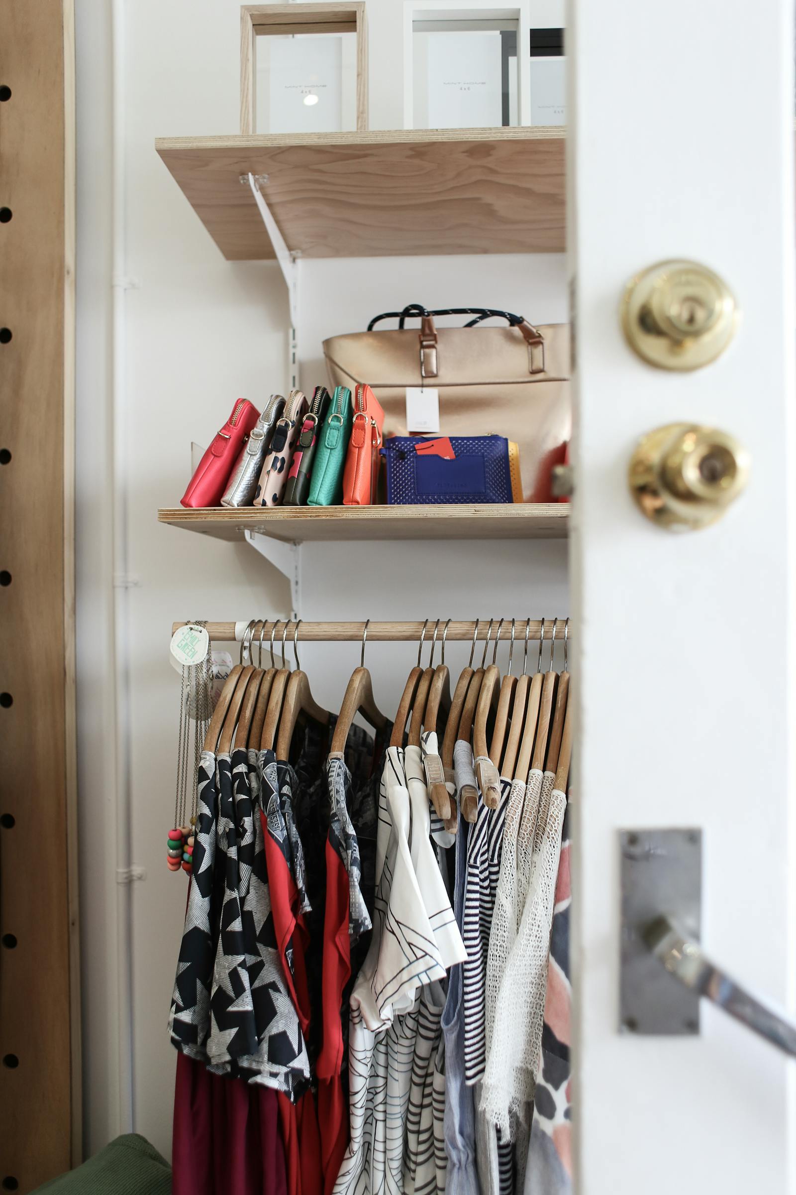 Organized wardrobe with clothing and bags after a cleanout plan